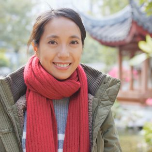 Woman wearing red scarf in the park